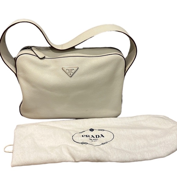 Prada Handbags - Authentic off-white leather Prada bag. Gently loved! Comes with dust bag.